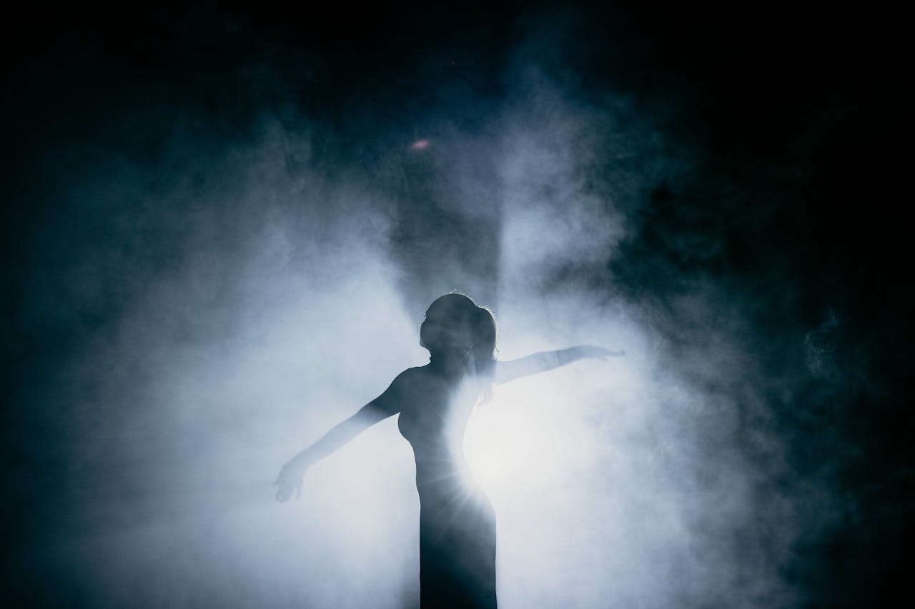 Woman Dancing with Smoke on Background